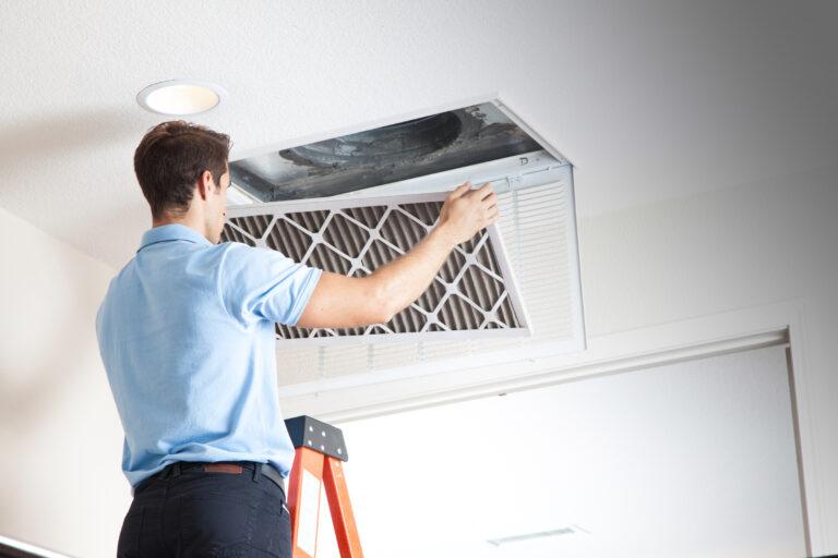 a technician cleaning duct.