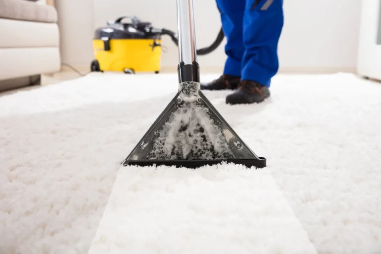 close shot of a vacuum cleaning of a white rug